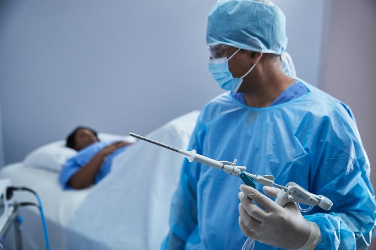 Surgeon holding medical device