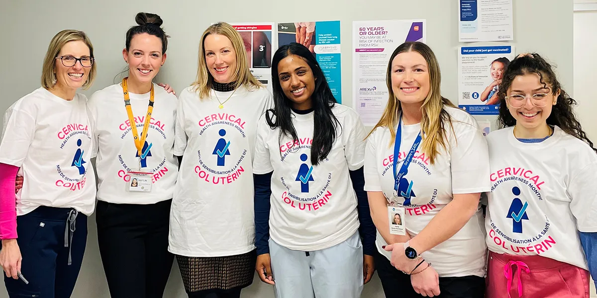 6 women in Cervical Health Awareness Month t-shirts standing in a clinic